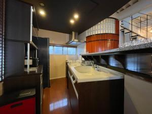 Kuchyň nebo kuchyňský kout v ubytování ロハスResort宮浦 + 14 fotografií