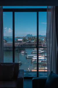 a view of a harbor from a hotel room window at Grace Samudera Hotel in Semporna