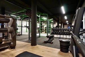 a gym with a bunch of equipment in it at Motel by Maier Götzis- kontaktloser Check-in in Götzis