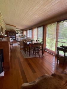 a large living room with a table and chairs at The Coach House on River and Park in Mudgee