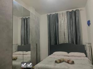 a bedroom with a bed and a large mirror at Appartamento Mire&Geo in Voghera +12 photos