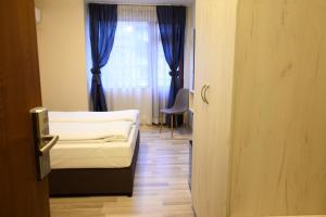Postel nebo postele na pokoji v ubytování Hotel Leda