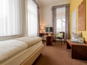 Postel nebo postele na pokoji v ubytování Villa Neptun