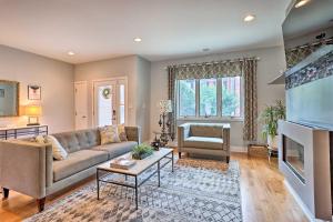 a living room with a couch and a fireplace at Chic Philly Townhome Less Than 3 Mi to Center City! in Philadelphia