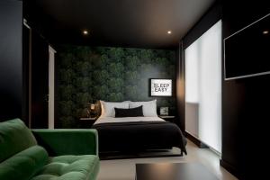 Postel nebo postele na pokoji v ubytování Kip Hotel