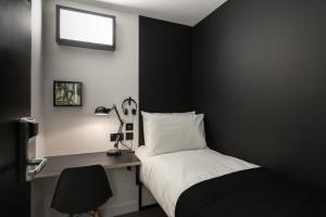 Postel nebo postele na pokoji v ubytování Kip Hotel + 9 fotografií
