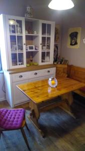 a kitchen with a wooden table and a wooden bench at Altes Bahnerhaus 