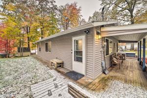 a tiny house with a porch and a deck at Dog-Friendly Harrison Retreat with Grill and Fire Pit! in Harrison