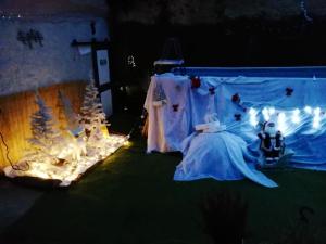 a stage with a woman in a white dress and lights at Maison de 2 chambres avec piscine privee jacuzzi et jardin clos a Wangen in Wangen
