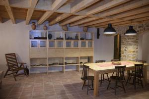 a dining room with a table and chairs at Vale das Maias - Casa de Campo in Laborins