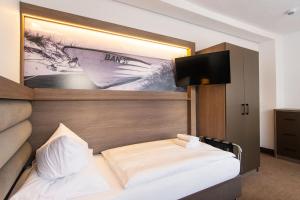 Ein Bett oder Betten in einem Zimmer der Unterkunft Villa Auszeit Hotel Garni