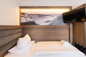 Ein Bett oder Betten in einem Zimmer der Unterkunft Villa Auszeit Hotel Garni