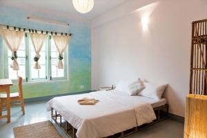 Tempat tidur dalam kamar di Ananda Tree House Eco Homestay