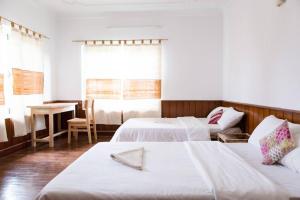 Postel nebo postele na pokoji v ubytování Ananda Tree House Eco Homestay