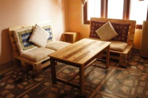 Posezení v ubytování Ananda Tree House Eco Homestay