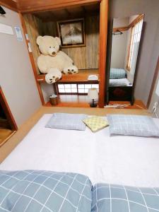 Postel nebo postele na pokoji v ubytování GUEST HOUSE SaKURa