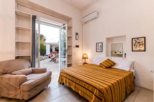 A bed or beds in a room at Trullo Cezanne sustainable and peaceful