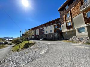 an empty street in front of a building at Gudauri Smart Apartment in Gudauri