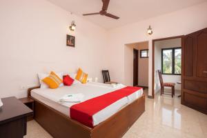 Una cama o camas en una habitación de Homested Homestay Fort Kochi