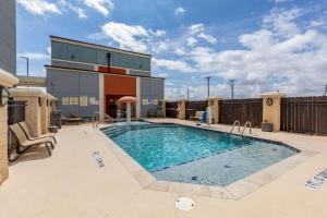 a swimming pool on the roof of a building at Best Western Plus North Odessa Inn & Suites in Odessa