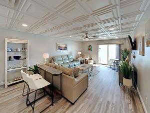 a living room with a couch and a table at Sans Souci #605 in Pensacola Beach