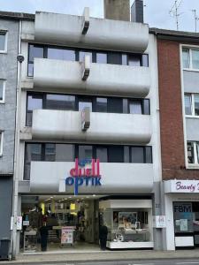 a building with a sign on the front of it at City-Wohnen in Düren im Boho-Style in Düren - Eifel