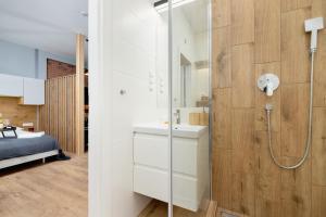 Kúpeľňa v ubytovaní Kraków Trendy Studio Apartments by Noclegi Renters