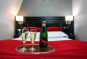 Voodi või voodid majutusasutuse Hôtel Eiffel Rive Gauche toas