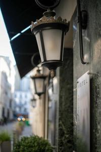 a street light on the side of a building at Hôtel Eiffel Rive Gauche in Paris
