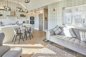 a living room with a couch and a table at Host & Stay - The Stables in Yarm