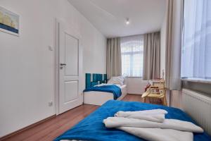 Ein Bett oder Betten in einem Zimmer der Unterkunft Baltic Home