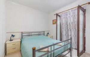 Postel nebo postele na pokoji v ubytování Apartments Nusha
