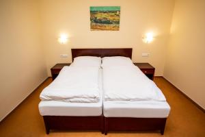 Postel nebo postele na pokoji v ubytování Hotel Boss