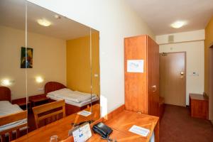 Postel nebo postele na pokoji v ubytování Hotel Boss