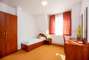 Postel nebo postele na pokoji v ubytování Hotel Boss