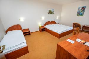 Postel nebo postele na pokoji v ubytování Hotel Boss