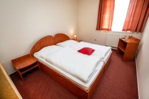 Postel nebo postele na pokoji v ubytování Hotel Boss