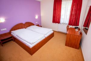 Postel nebo postele na pokoji v ubytování Hotel Boss