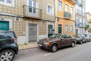 a group of cars parked on the side of a street at Fernando Lemos Estúdio Lisboa in Lisbon