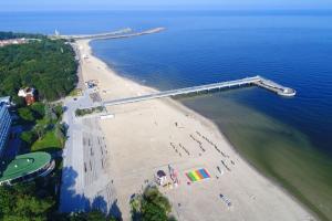 an aerial view of a beach with a bridge at Apartment in Kolobrzeg with parking space in Kołobrzeg
