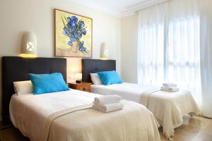 Łóżko lub łóżka w pokoju w obiekcie Hipoclub Villas, Aguamarina 1