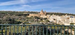 a view of a city from a balcony at Harruba Flt 3 Triq il Gudja in Mġarr