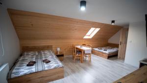 Säng eller sängar i ett rum på U Jędrusia