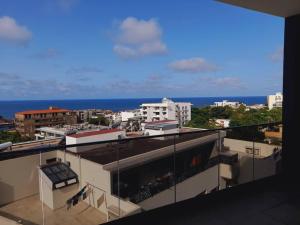 a view of the ocean from a building at Waypoint Suites in Dakar