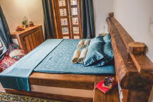 Postel nebo postele na pokoji v ubytování Boho's Hotel