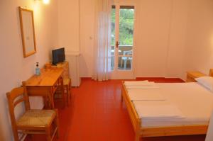 Posteľ alebo postele v izbe v ubytovaní Chalikias Rooms