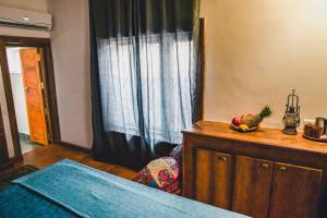 Postel nebo postele na pokoji v ubytování Boho's Hotel
