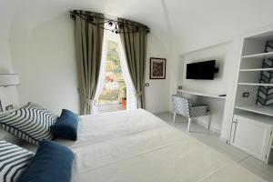 Postel nebo postele na pokoji v ubytování Milky Suites Positano
