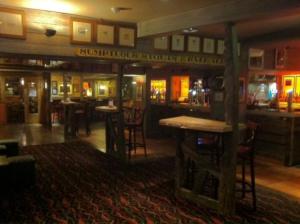 a bar in a pub with tables and chairs at Waterford Lodge Hotel in Morpeth