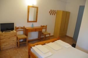 Posteľ alebo postele v izbe v ubytovaní Chalikias Rooms